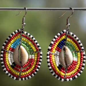 Oval shaped mixed maasai beads earring fixed with wires & a cowrie shell in the middle.