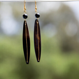 Brown diamond-like bone with black beads and brass.