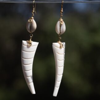 White Elephant Shaped Ivory bone with a shell earring which is fixed with a brass wire.